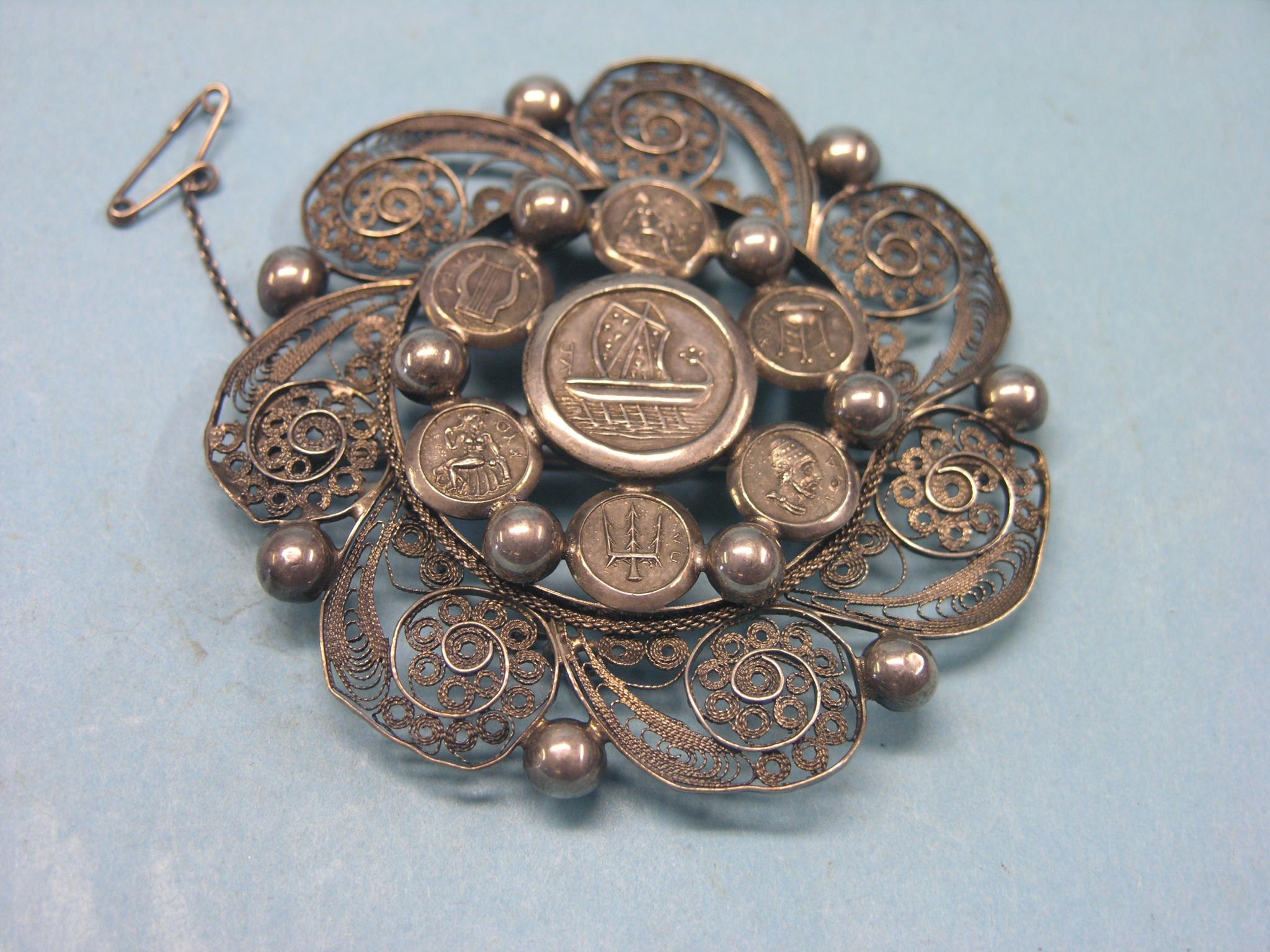 Appraisal: A Greek white metal filigree brooch rosette design in diameter