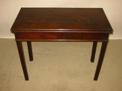 Appraisal: A GEORGE III MAHOGANY FOLDING CARD TABLE the moulded edged