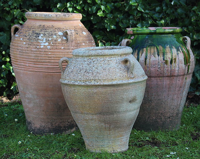 Appraisal: A TERRACOTTA PITHOI TYPE JAR of inverted baluster form with