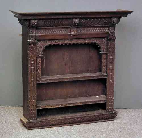 Appraisal: A late Victorian ''Black Oak'' hanging wall shelf with moulded