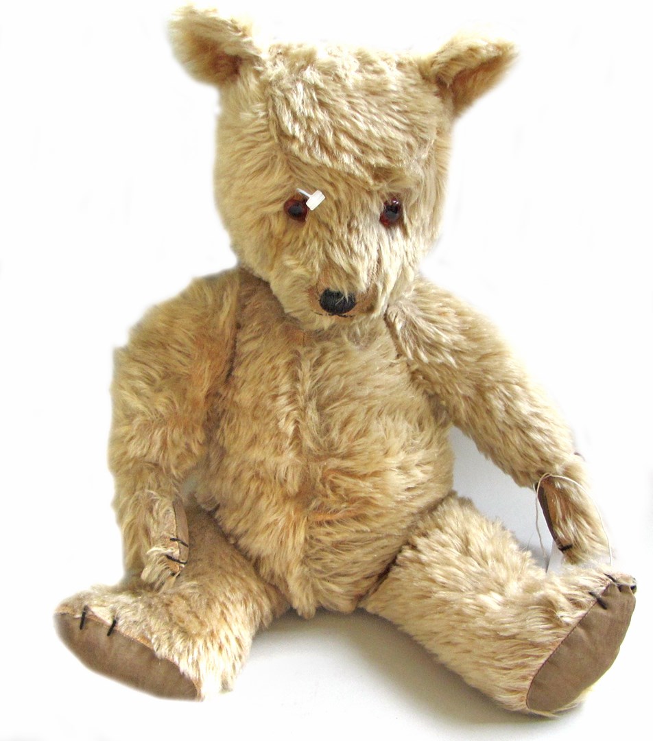 Appraisal: A vintage teddy bear mid th century with golden fur