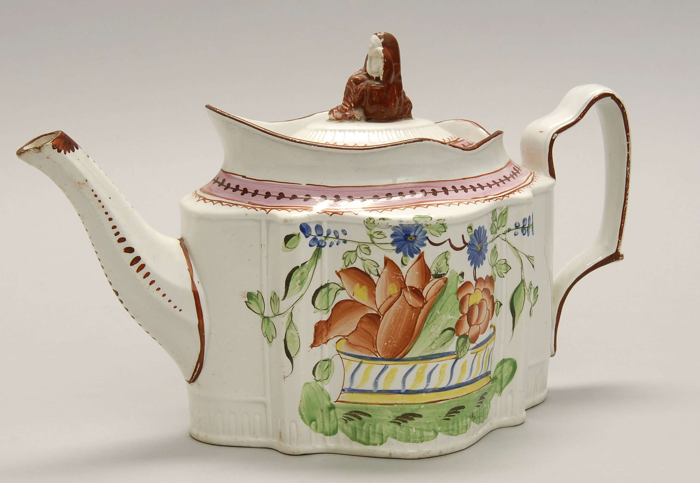 Appraisal: ENAMEL-DECORATED LEEDS POTTERY TEAPOT Early th CenturyIn lozenge form with