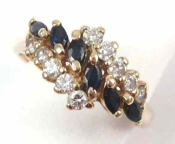 Appraisal: SAPPHIRE DIAMOND AND FOURTEEN KARAT GOLD RING set with six