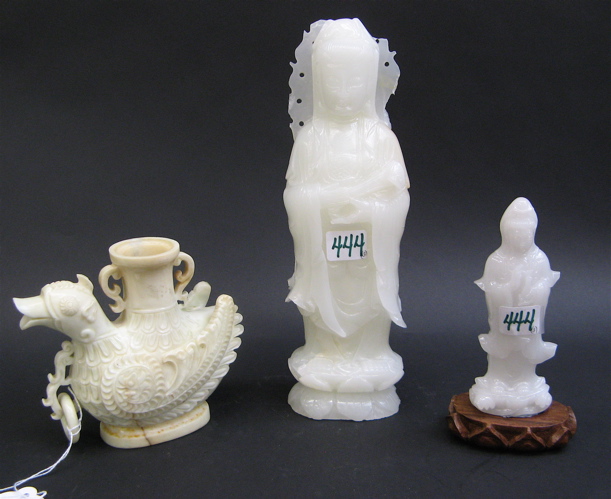 Appraisal: THREE PIECES CARVED JADE a white jadeite figure of Kuan