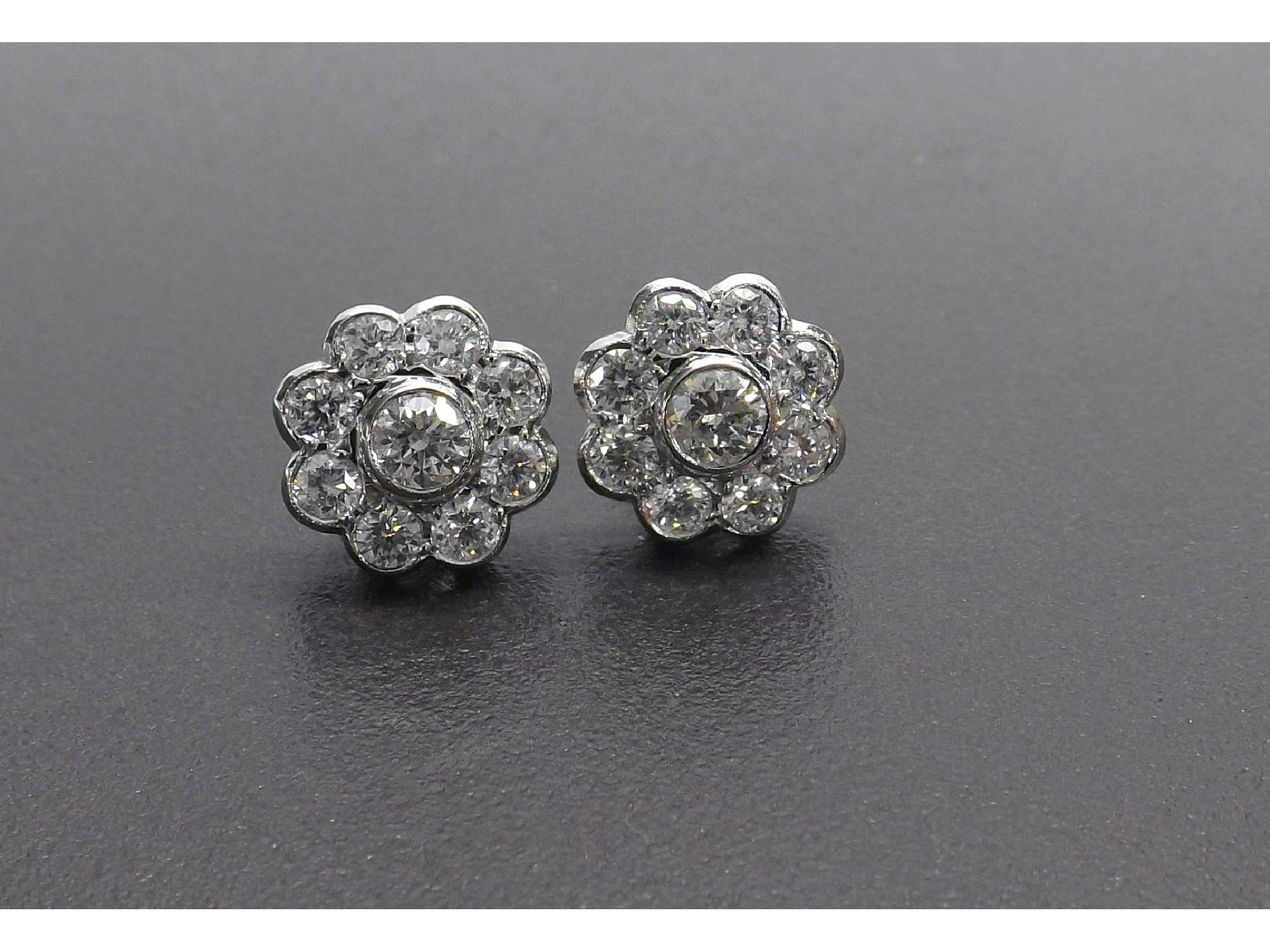 Appraisal: Good pair of ct white gold diamond floral cluster earrings