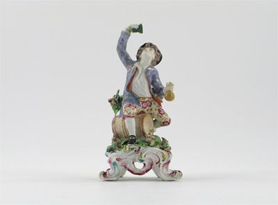 Appraisal: A Bow figure of a drunkard sitting astride a barrel