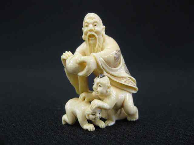 Appraisal: Carved Ivory Netsuke of a Man holding a large peach