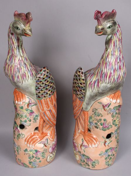 Appraisal: Pair of Oriental porcelain phoenixes having floral design perched on