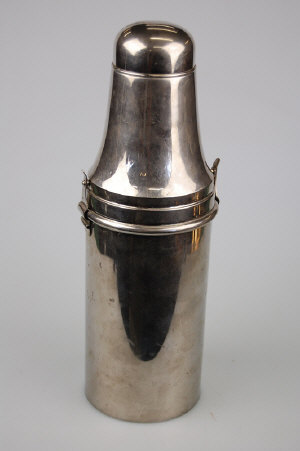 Appraisal: An ep cocktail shaker with domed cover enclosing strainer the