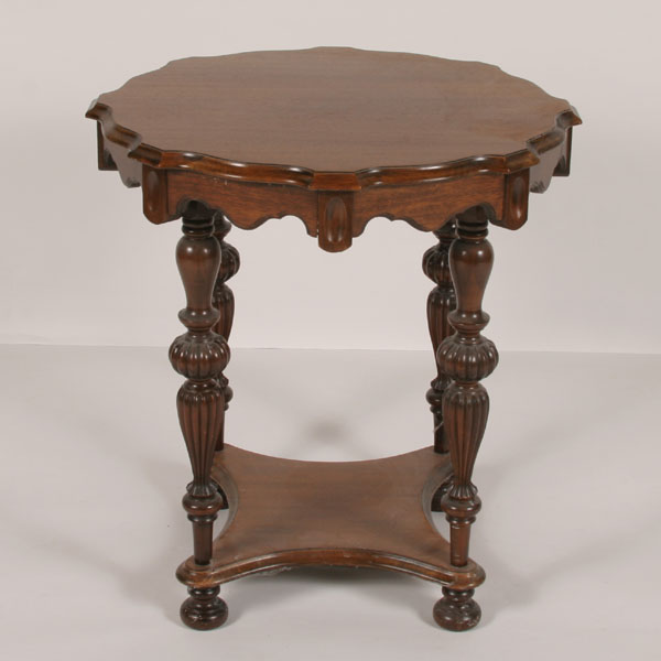 Appraisal: Deco round top lamp table shaped apron solid stretcher base