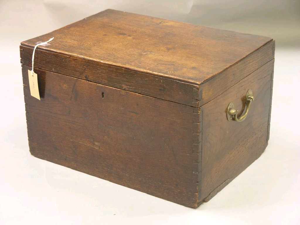 Appraisal: A Georgian oak box boarded construction with brass carrying handles