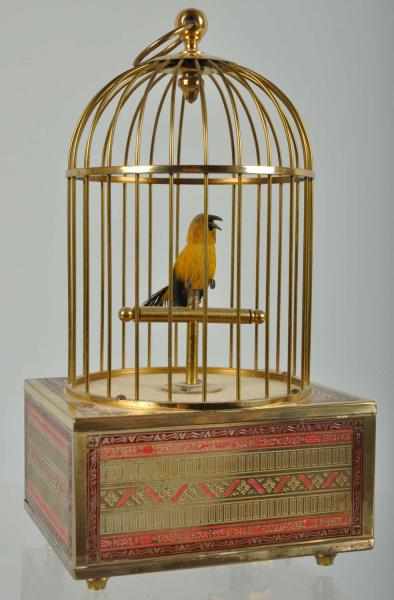 Appraisal: Brass Bird Cage with Whistling Feathered Bird Description German Working