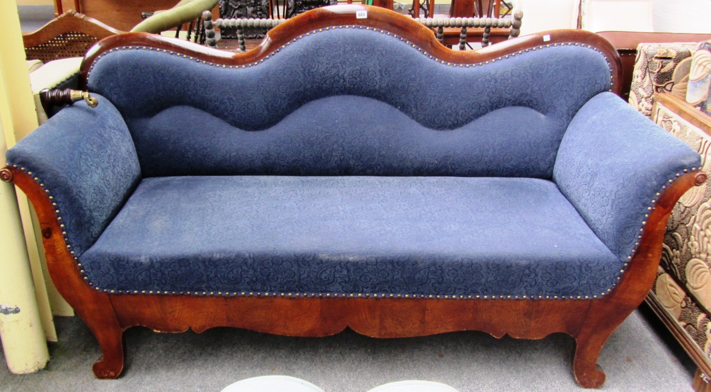 Appraisal: A th century European mahogany framed scroll end sofa on