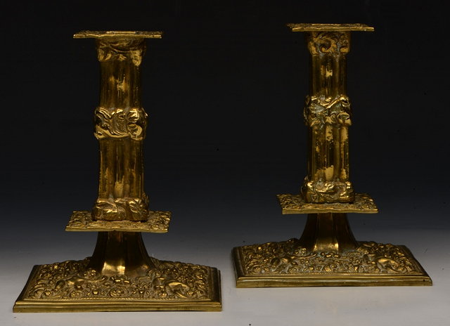 Appraisal: A PAIR OF VICTORIAN BRASS CANDLESTICKS of square section columnar