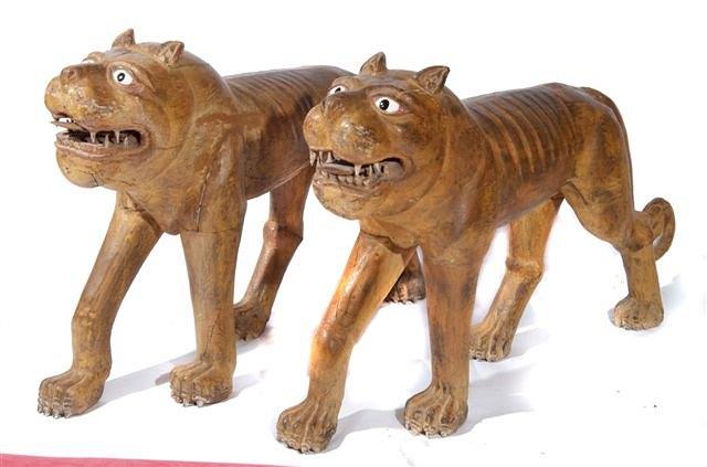 Appraisal: A PAIR OF INDIAN GUJARAT LIFE SIZED CARVED HARDWOOD TIGERS