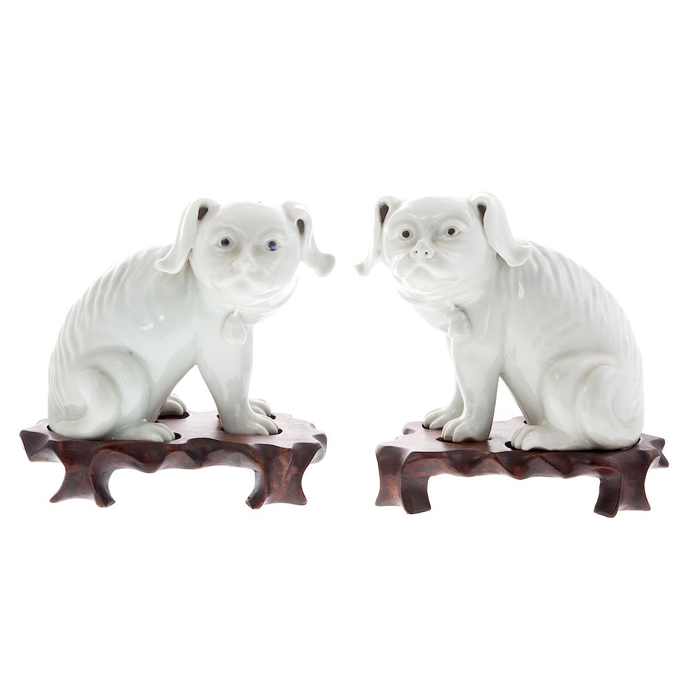 Appraisal: Pair Chinese Blanc-de-Chine porcelain dogs seated dogs with colored eyes