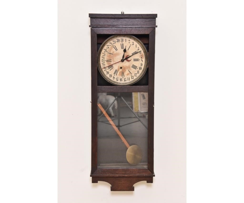 Appraisal: Oak-faced calendar wall clock h x w x d Condition