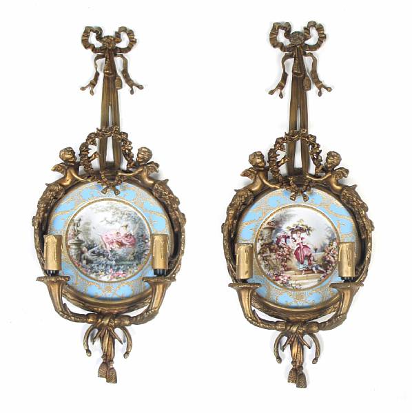 Appraisal: A pair of gilt bronze and porcelain two light girandoles