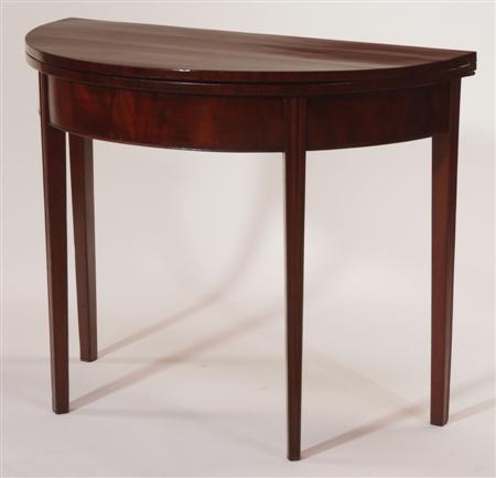 Appraisal: A th century mahogany demi-lune tea table with plain frieze