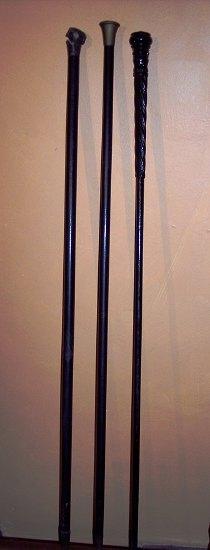 Appraisal: Three ebonised walking sticks various