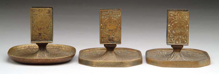 Appraisal: TIFFANY STUDIOS ZODIAC MATCHBOX HOLDERS Three Zodiac upright matchbox holders