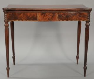 Appraisal: Sheraton mahogany game table with shaped top over conforming frieze