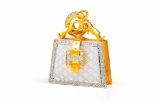 Appraisal: A Gold Diamond and Mother of Pearl Purse Locket Pendant