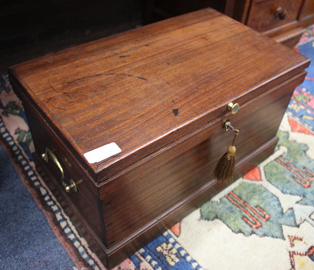 Appraisal: A MAHOGANY BOX with brass swan neck carrying handles to