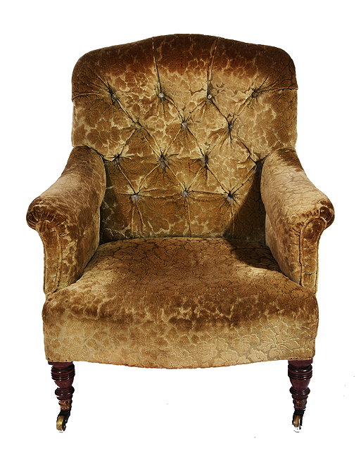 Appraisal: A VICTORIAN GREEN VELVET BUTTON BACK UPHOLSTERED LOW ARMCHAIR by