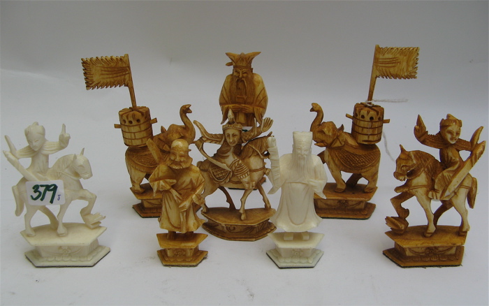 Appraisal: COLLECTION OF EIGHT HAND CARVED IVORY FIGURES six stained in