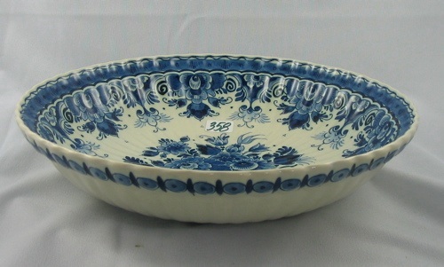 Appraisal: A DUTCH DELFTS PORCELAIN BOWL having blue center basket bouquet