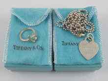 Appraisal: Tiffany Co a silver Tiffany heart ''ID'' pendant and a