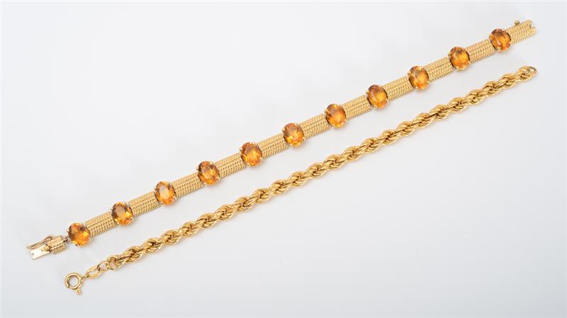 Appraisal: TWO GOLD BRACELTS The first k gold with oval-shaped citrines