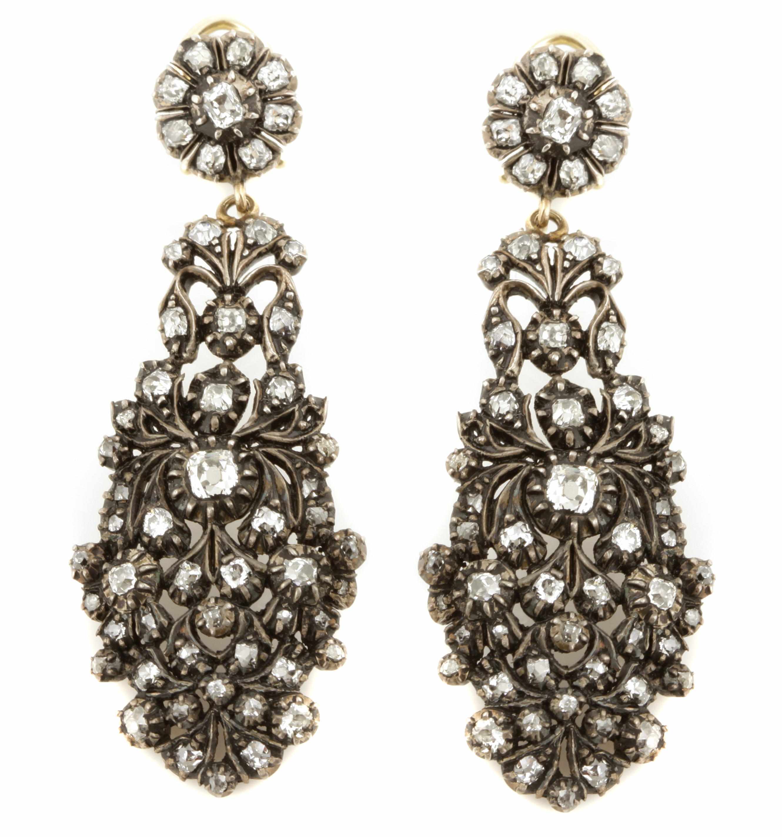 Appraisal: A pair of diamond and silver-topped gold earrings