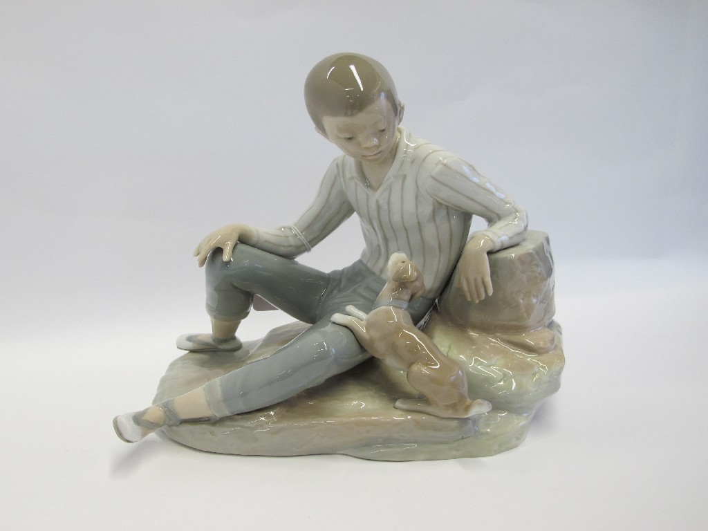 Appraisal: Large Lladro figure 'Boy with Dog' designed by Fulgencio Garcia