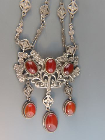 Appraisal: Peruzzi Silver and Carnelian Necklace rich cabachons ornate setting famous