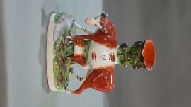 Appraisal: A Staffordshire spill vase of a cow and calf cmh