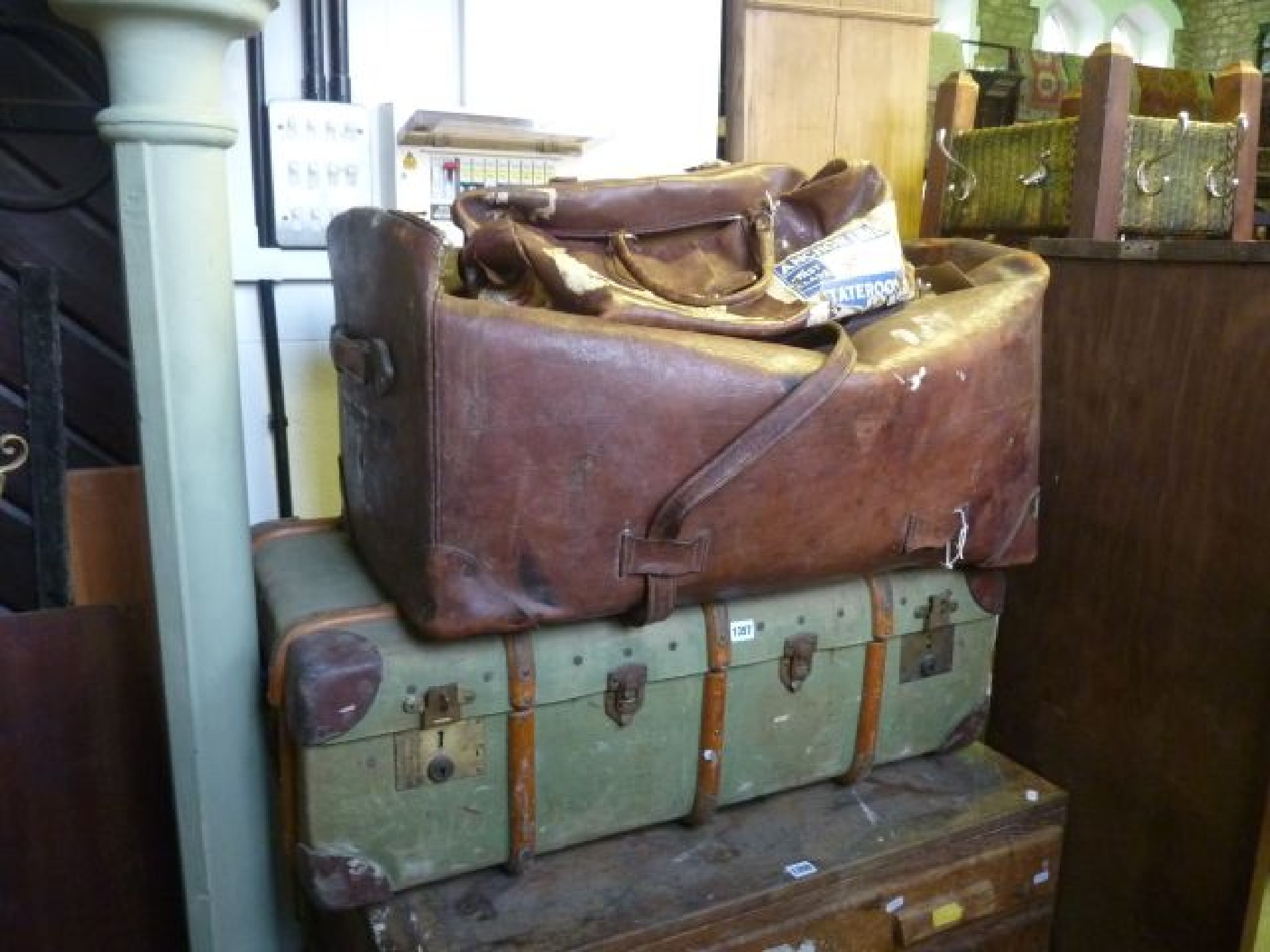 Appraisal: A large vintage leather holdall with leather straps a further