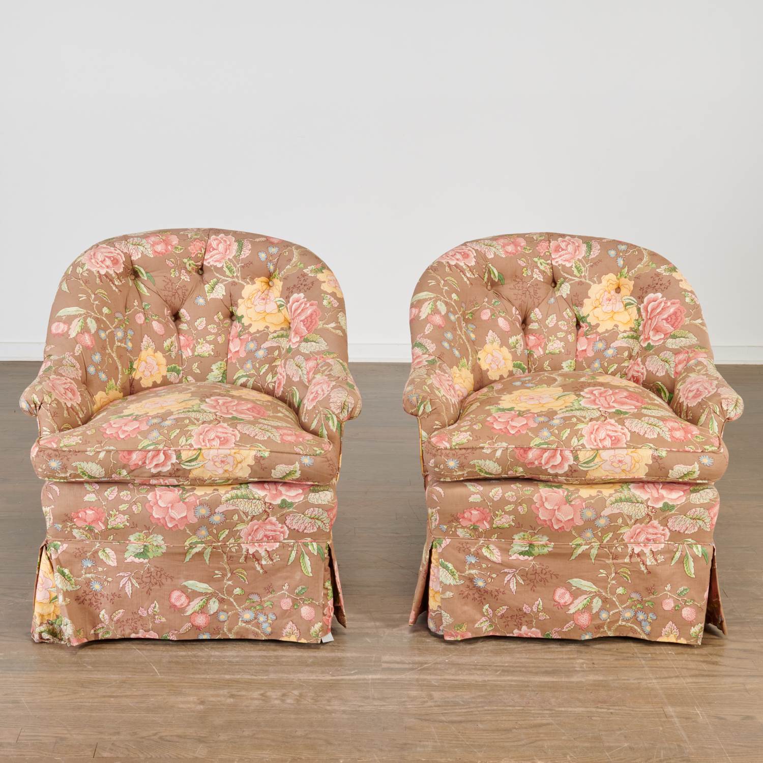 Appraisal: PAIR CUSTOM CHINTZ UPHOLSTERED LOUNGE CHAIRS th c button-tufted back