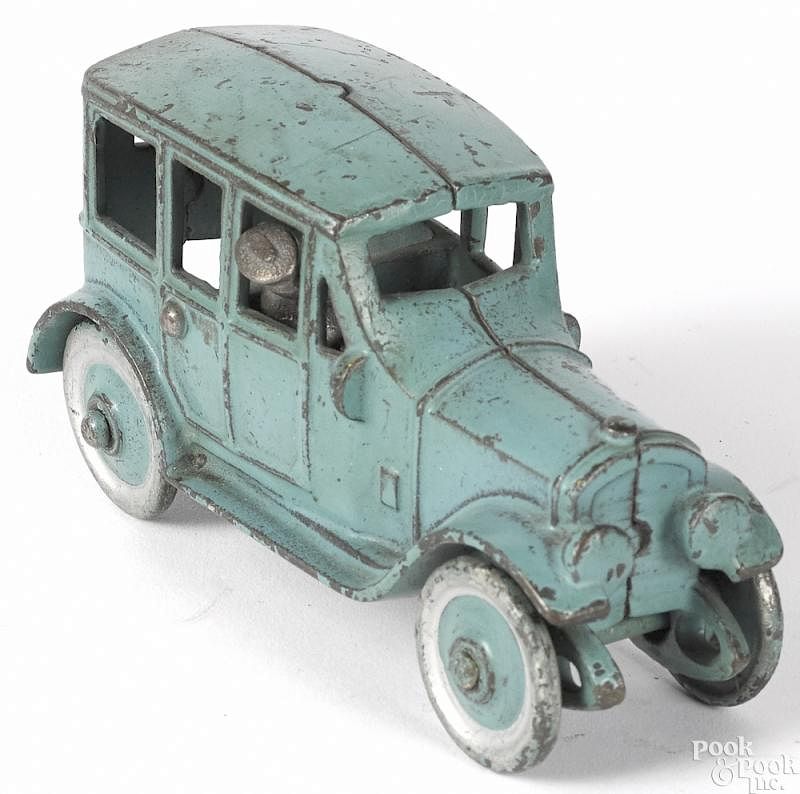 Appraisal: Kenton cast iron sedan with cast iron driver Kenton cast