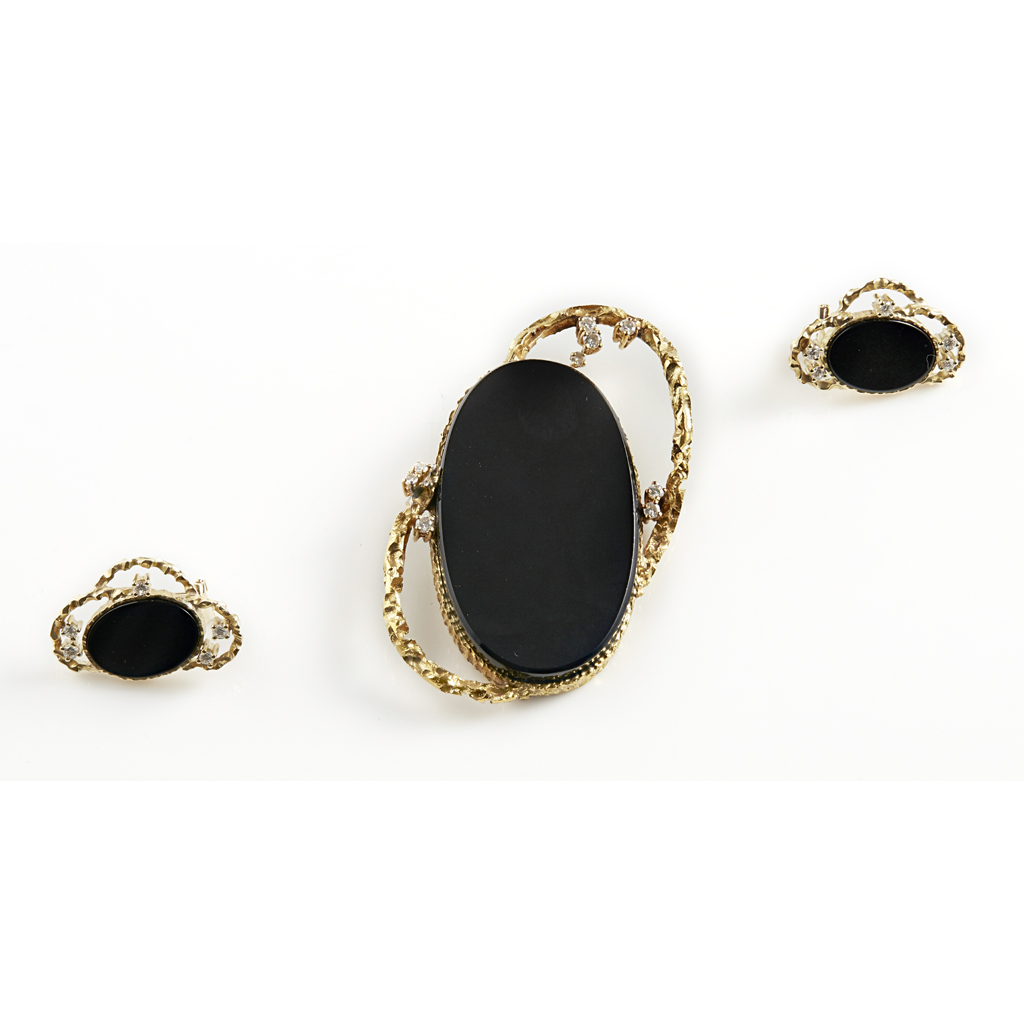 Appraisal: A diamond and onyx set pendant and earrings the pendant