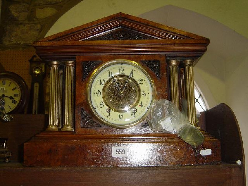 Appraisal: A Victorian mantle clock in a burr walnut case of