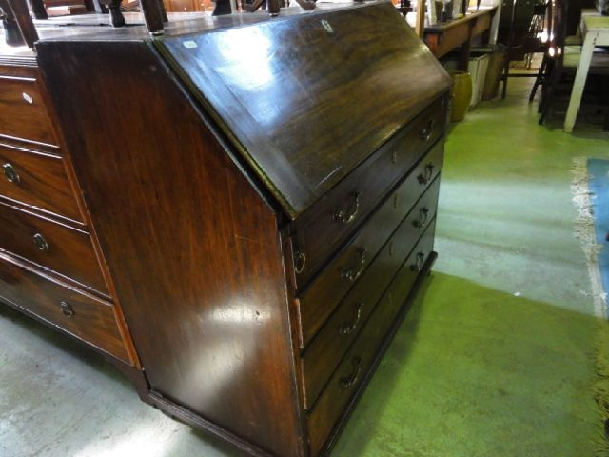 Appraisal: A Georgian mahogany bureau the fall front enclosing a fitted