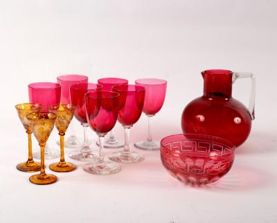 Appraisal: A quantity of cranberry glass and three amber tinted cordial