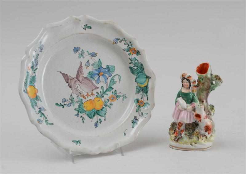 Appraisal: FAIENCE POLYCHROME PLATE AND A STAFFORDSHIRE FIGURAL SPILL VASE The