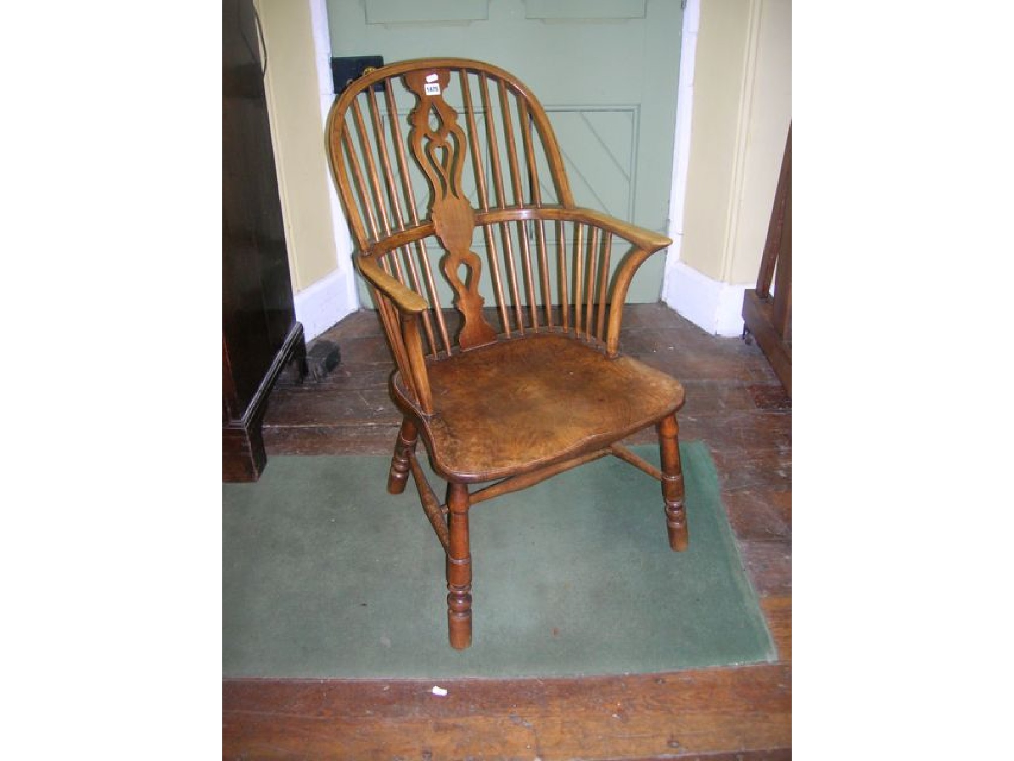 Appraisal: An early th century Windsor hoop back elbow chair with