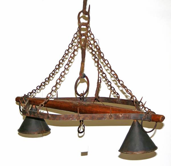 Appraisal: A Spanish Baroque style iron and oak yoke form two