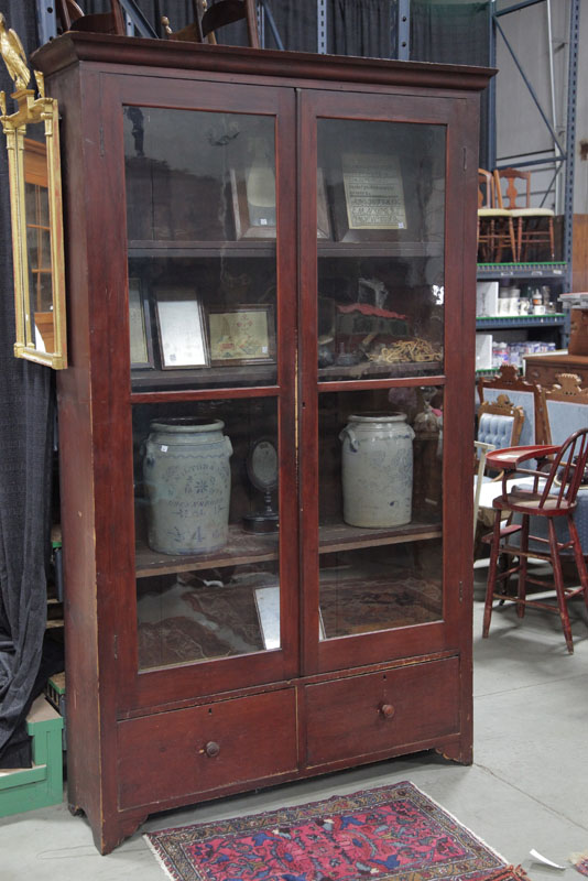 Appraisal: BOOKCASE Square nail construction red stain two large glazed doors