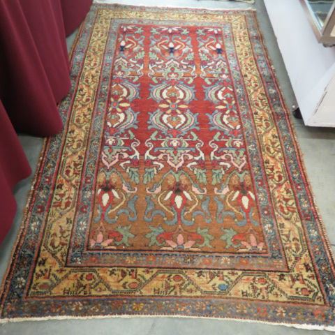 Appraisal: Semi-Antique Persian Handmade Rug florals red-brown field ' x '