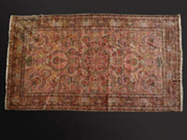 Appraisal: A Persian Kirman floral palmette wool carpet rug A Persian